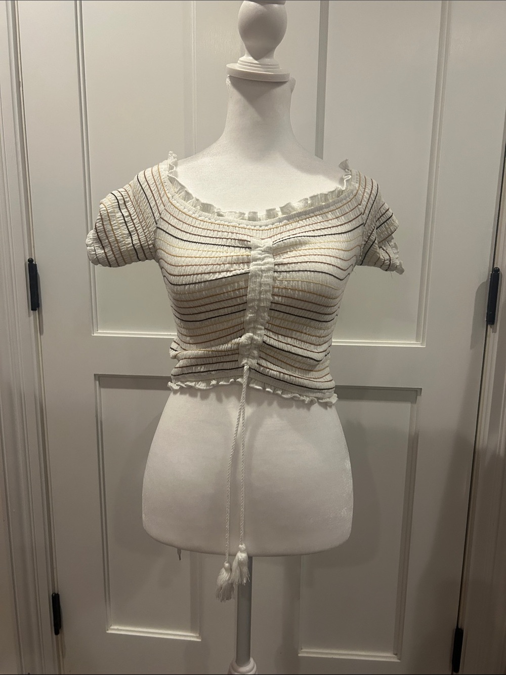 Storia Smocked off the shoulder tassel crop top